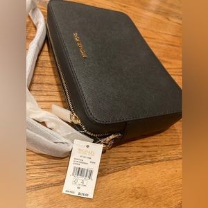 Brand New with tags Michael Kors Jet Set Crossbody purse.
